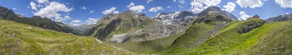 Unterhalb des Taschachhauses (2434m) mit Blick entlang des langgestreckten Taschachtals, auf den Geigenkamm mit Hoher Geige (3394m), Puitkogel (3345m) und Wassertalkogel (3247m) sowie auf den Taschachferner mit seiner hohen Randmoräne und den gegenüber aufragenden Bergen Mitterkopf (3347m), Vorderer und Hinterer Bruchkogel (3393m / 3340m), Pitztal, Juli 2018.